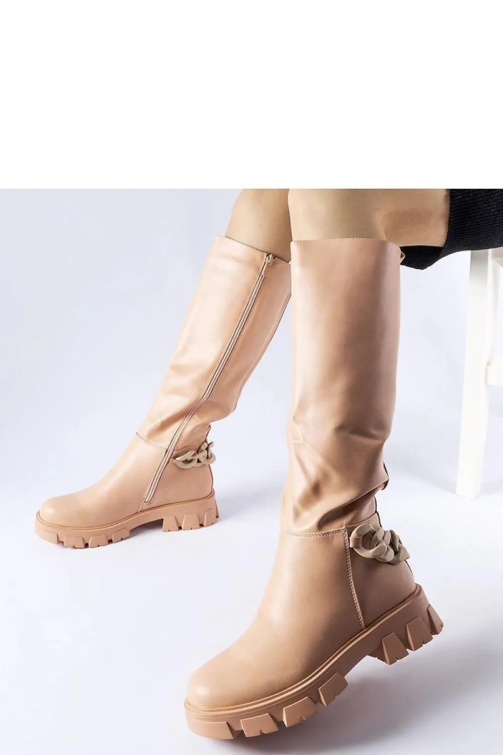 Pink flat knee-high boots with a chain