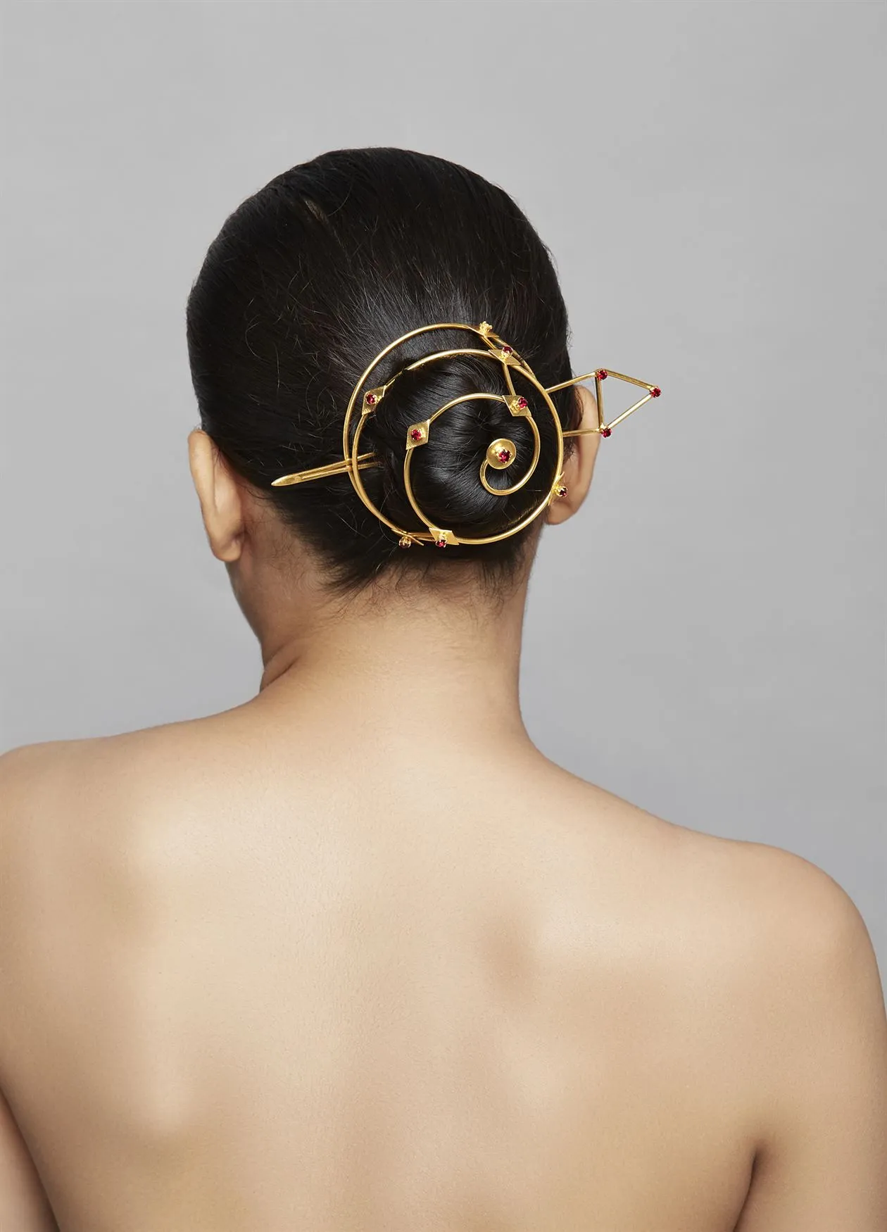 Roma Narsinghani Ruby Rock Hairbun Hair bun The piece is set in brass, hand set with swarvoski in 18KT gold finesse. Each piece is unique and handcrafted by our artisans. RNLOVE21